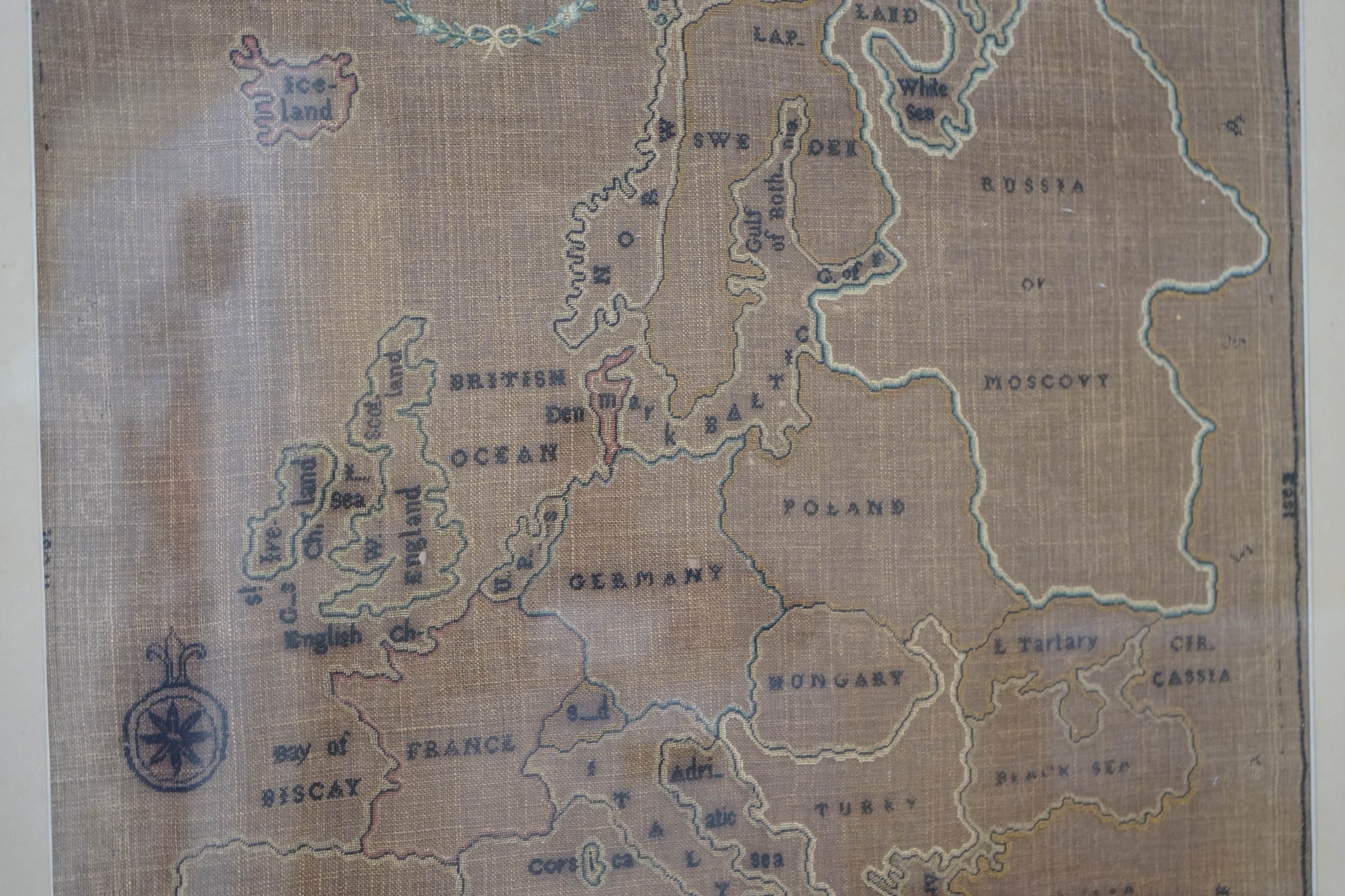 A late 19th century map sampler of Europe, linen backing discoloured by the light and sun, 46cm wide, 47.5cm high. Condition - fair, discolouration and staining